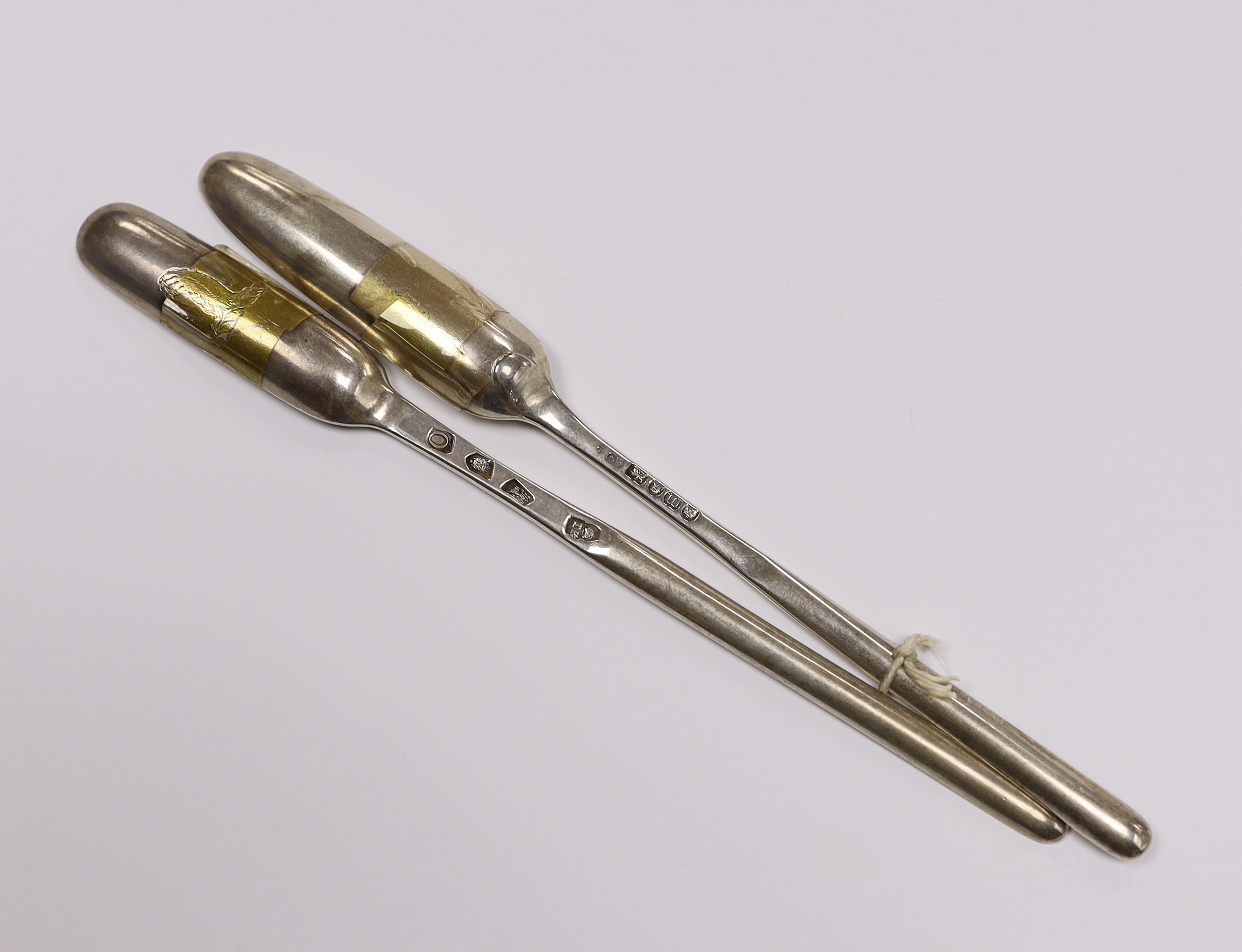 A George II silver marrow scoop, by Jeremiah King, London, 1729 and one other later silver marrow scoop, London, 1787, both approx. 22.7cm, 97 grams.